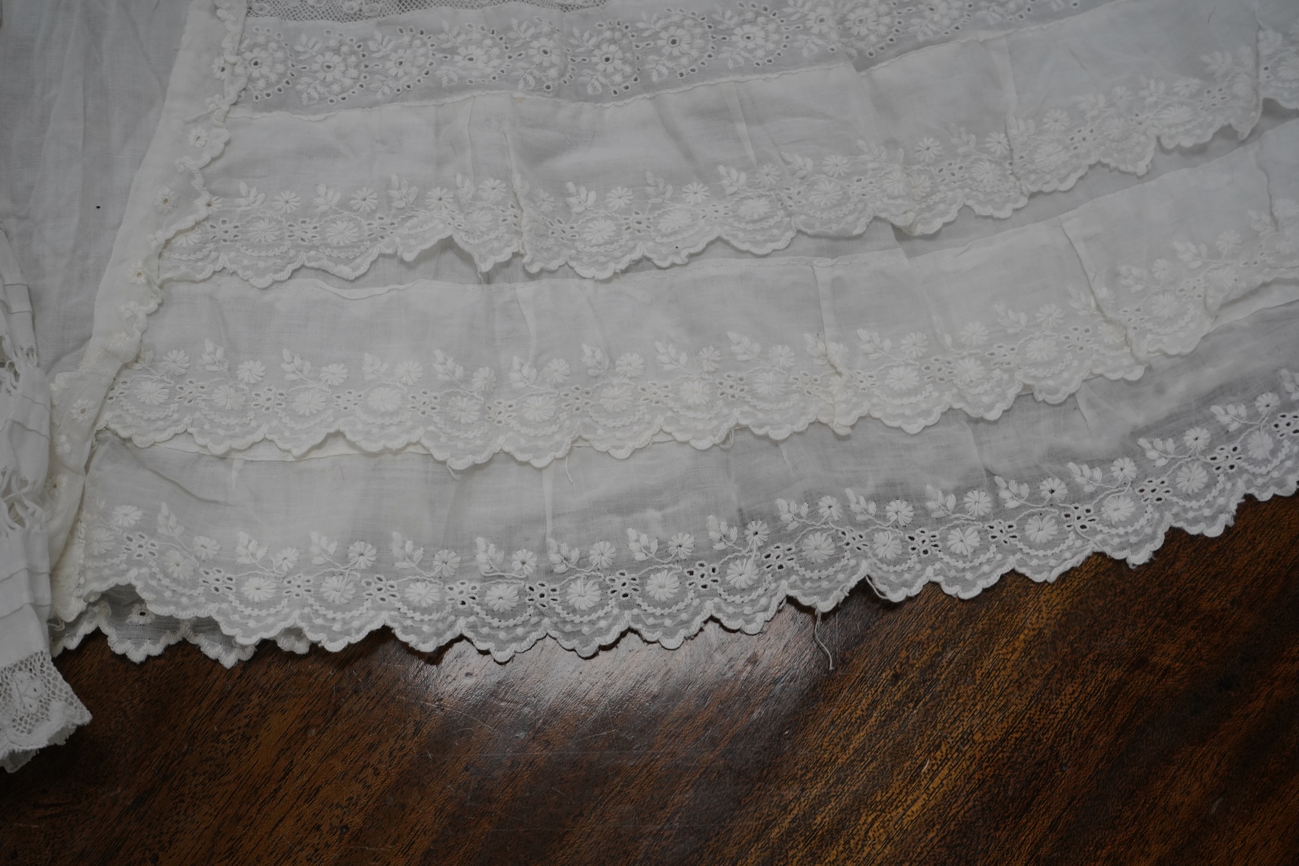 Five Victorian white worked fine cotton and lawn baby’s christening gowns. mostly worked with embroidery anglaise, feather stitching, tucking, drawn thread work and lace edging, longest 41cm. Condition - in good conditio